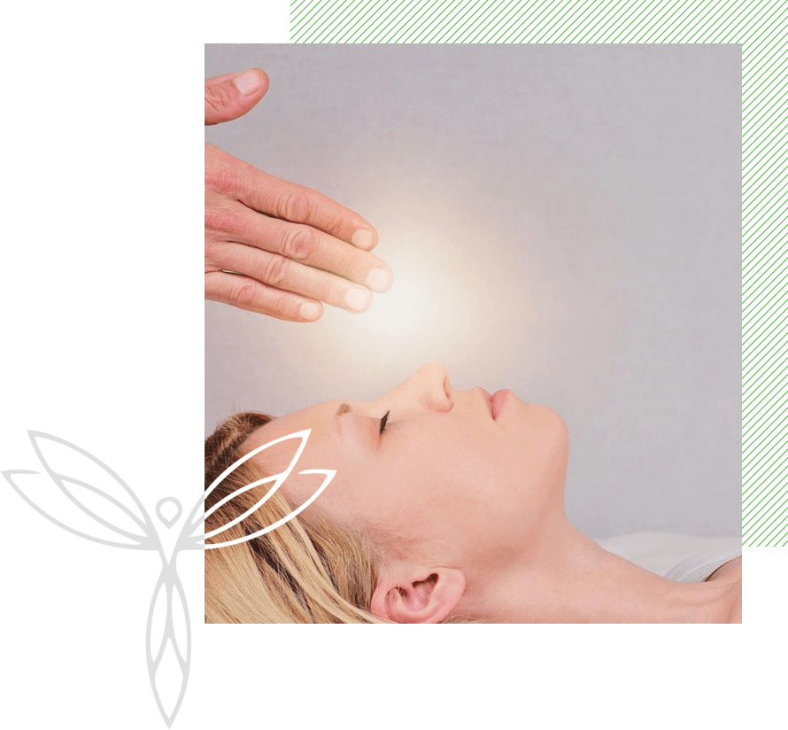 A person is getting reiki done on their face.