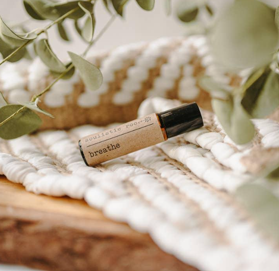 A bottle of foundation sitting on top of a rug.