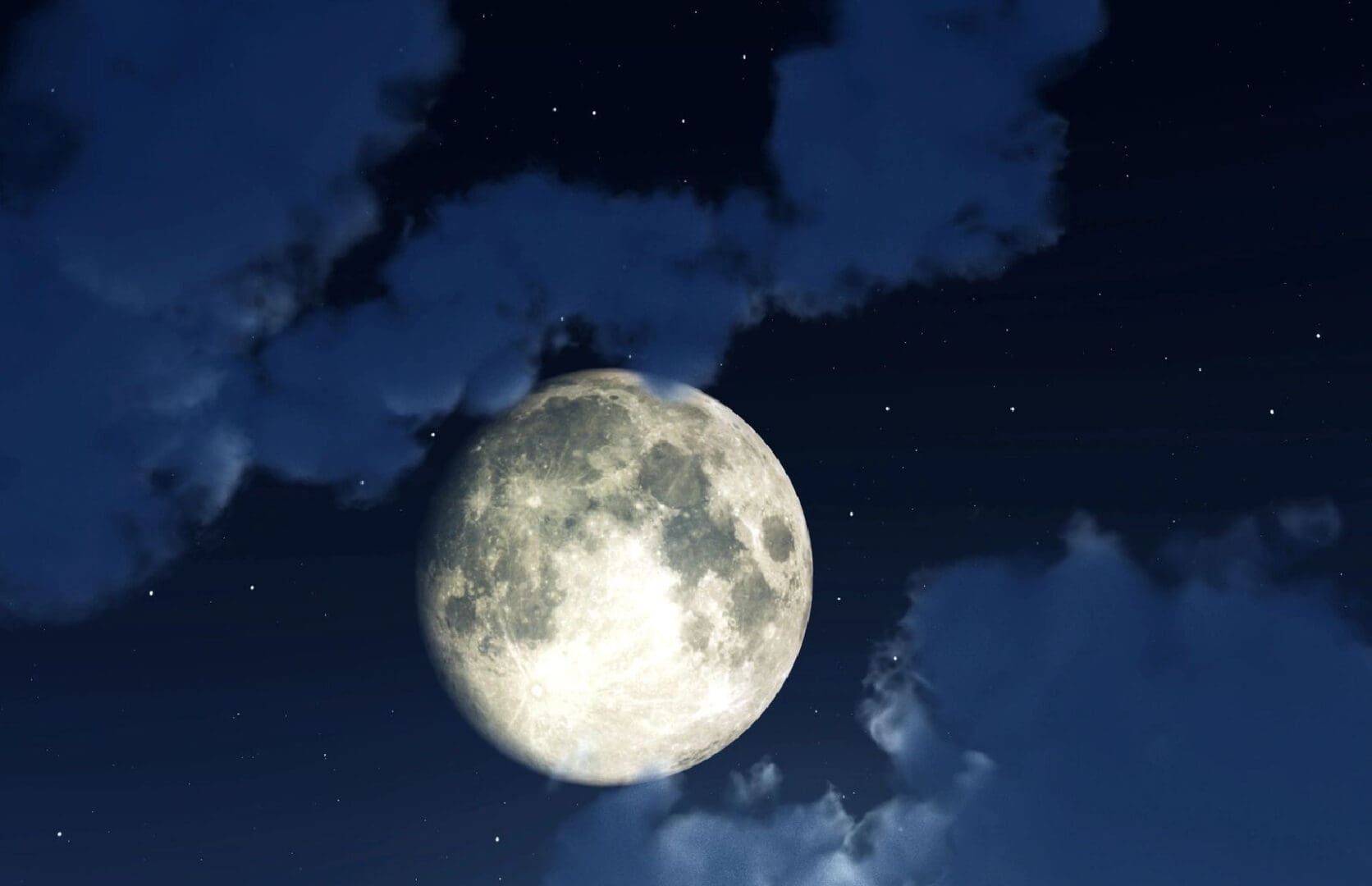 A full moon with clouds in the background.