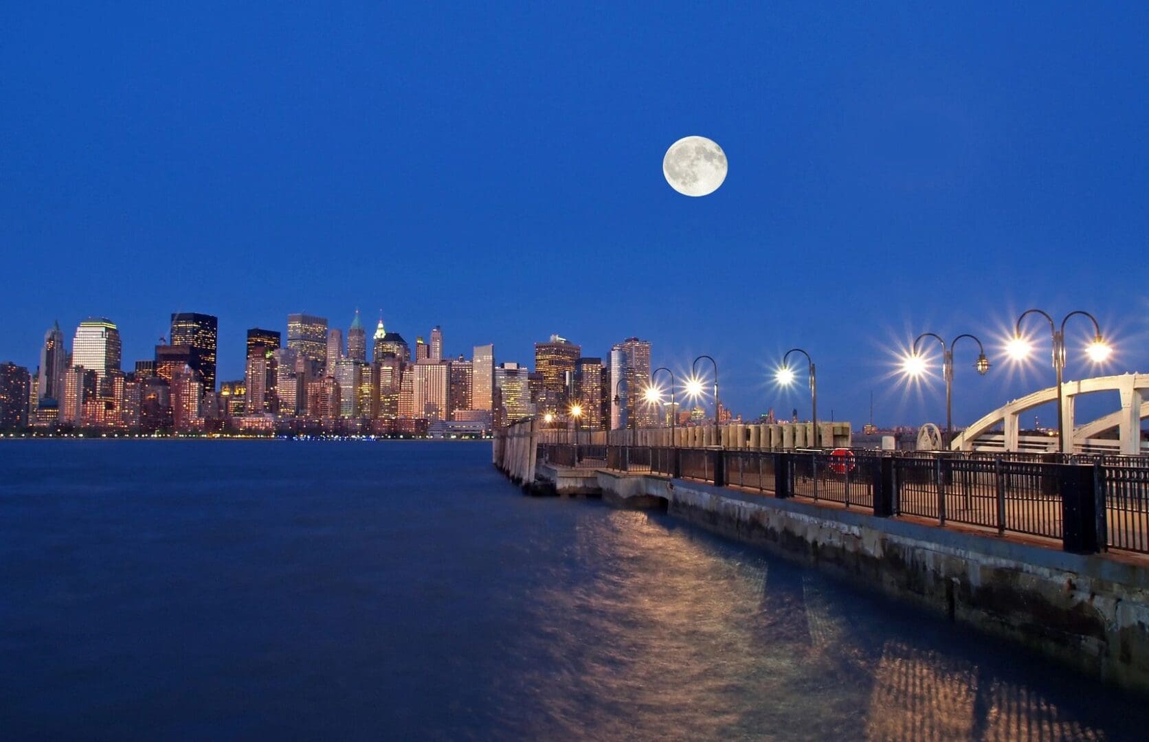 A full moon over the city skyline.